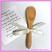 A close up of an example of our mini bamboo spoon decorated as a kitchen tea invitation.