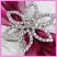 Closeup of our stunning diamante flower brooch on a burgundy organza ribbon make this wedding invitation sparkle!